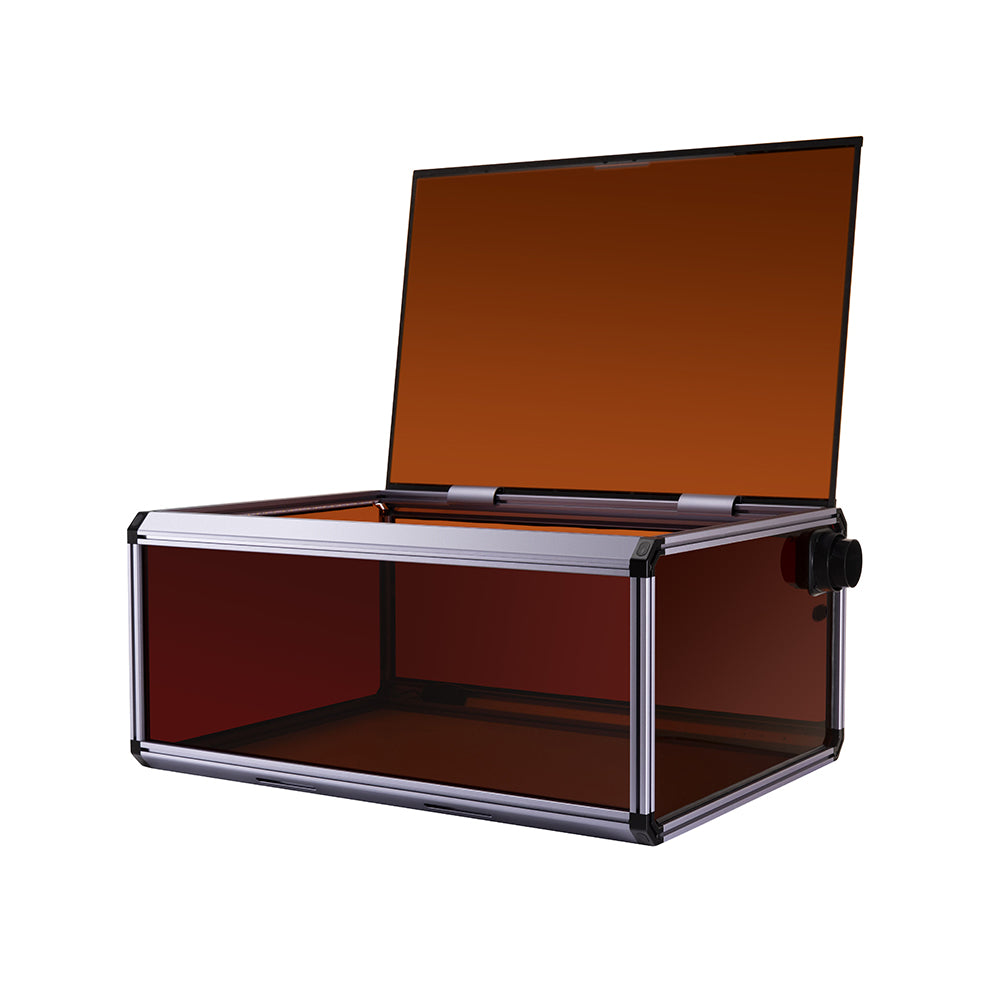 Snapmaker Ray enclosure with an open lid, revealing its organized laser engraving workspace and simple setup process.