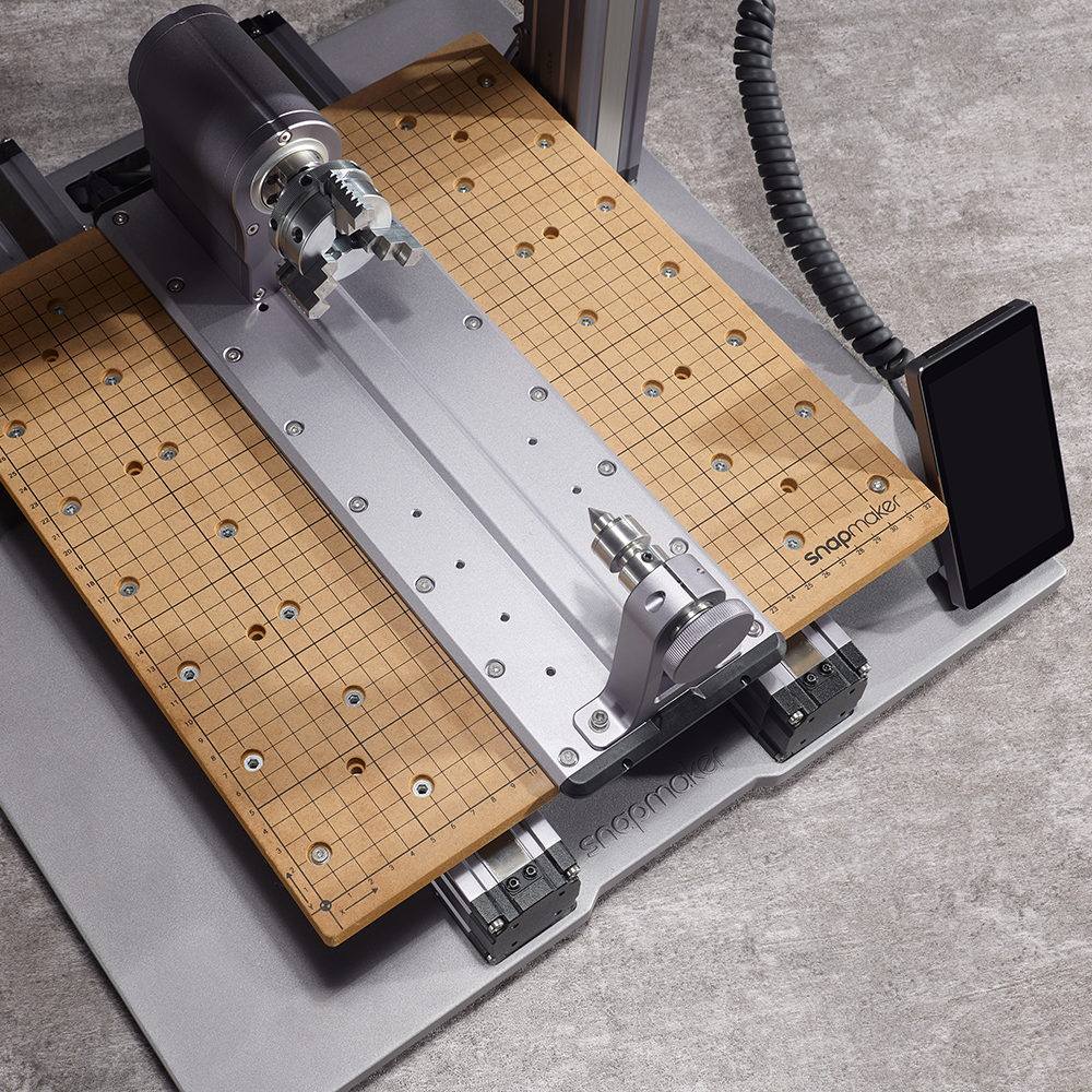 Snapmaker Rotary Module with precision grid worktable and control interface.