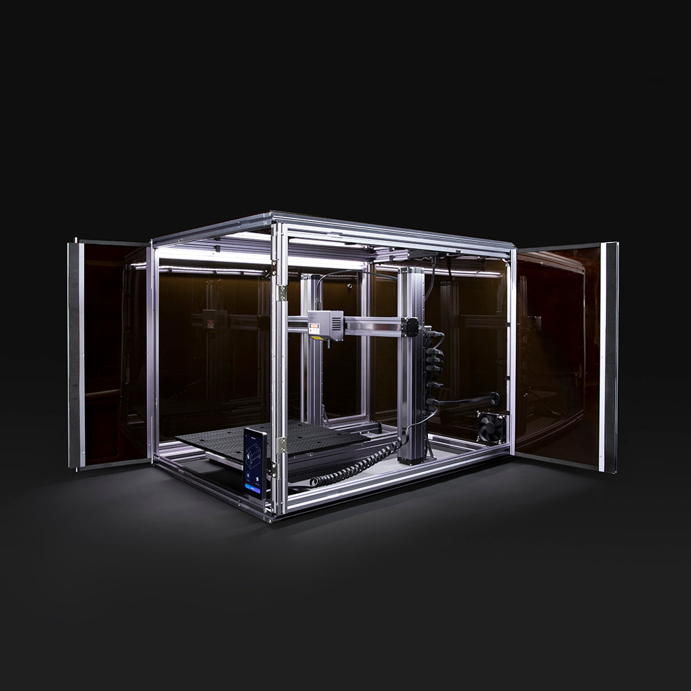 Snapmaker 3D printer enclosure with opened doors, showcasing the spacious interior for 3D printing setup and operation.