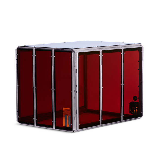Snapmaker 3D printer enclosure with transparent red panels, providing a controlled environment for 3D printing.