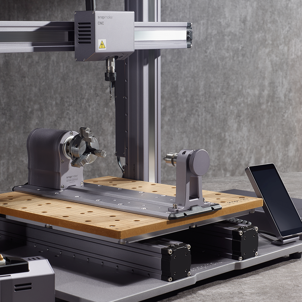 A detailed view of Snapmaker Rotary Module, showcasing its integration with the CNC machine and control interface.